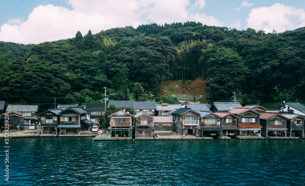 “Ine no Funaya (伊根の舟屋)” is a small village located in Ine town, Kyoto prefecture. Ine is a small town in northern Kyoto, approx 130km away from Kyoto city. The village stretches approx 5km along Ine B “Ine no Funaya (伊根の舟屋)” is a small village located in Ine town, Kyoto prefecture. Ine is a small town in northern Kyoto, approx 130km away from Kyoto city. The village stretches approx 5km along Ine B