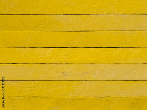 Wallpaper Mural Background of yellow popsicle sticks with horizontal view. Torontodigital.ca