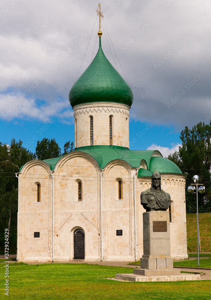 View of white-stone Transfiguration Cathedral and monument to Prince Alexander Nevsky in Pereslavl Kremlin, Pereslavl-Zalessky, Russia