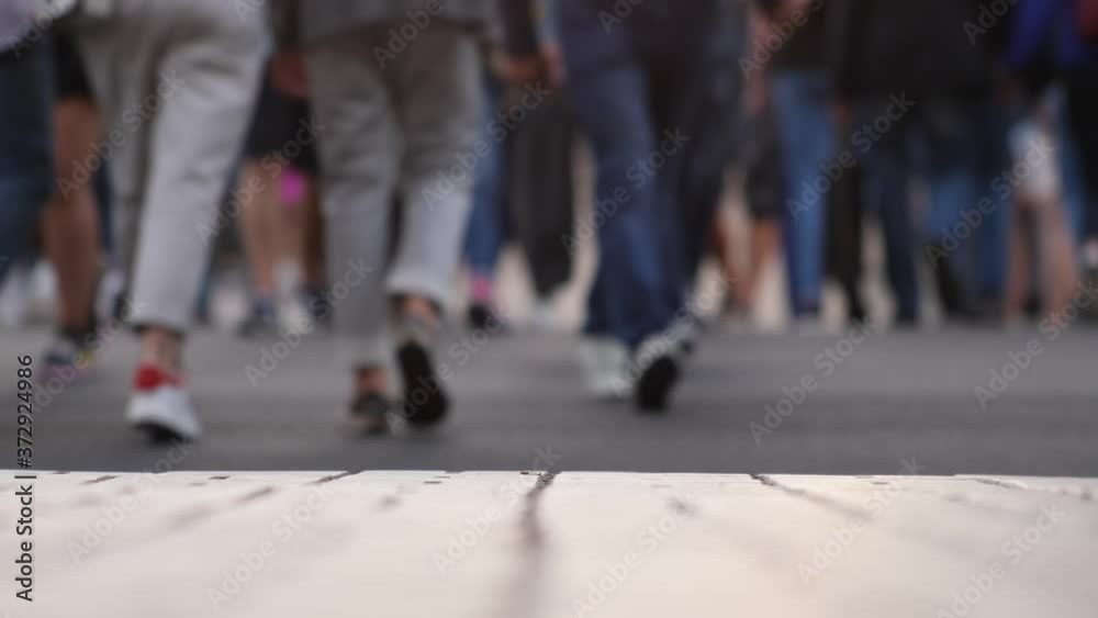 Closeup view of human feet people walking on crowded street in slow motion movement of life people variety pedestrian active walk city life urban many legs shoes traveling persons crowd Closeup view of human feet people walking on crowded street in slow motion movement of life people variety pedestrian active walk city life urban many legs shoes traveling persons crowd