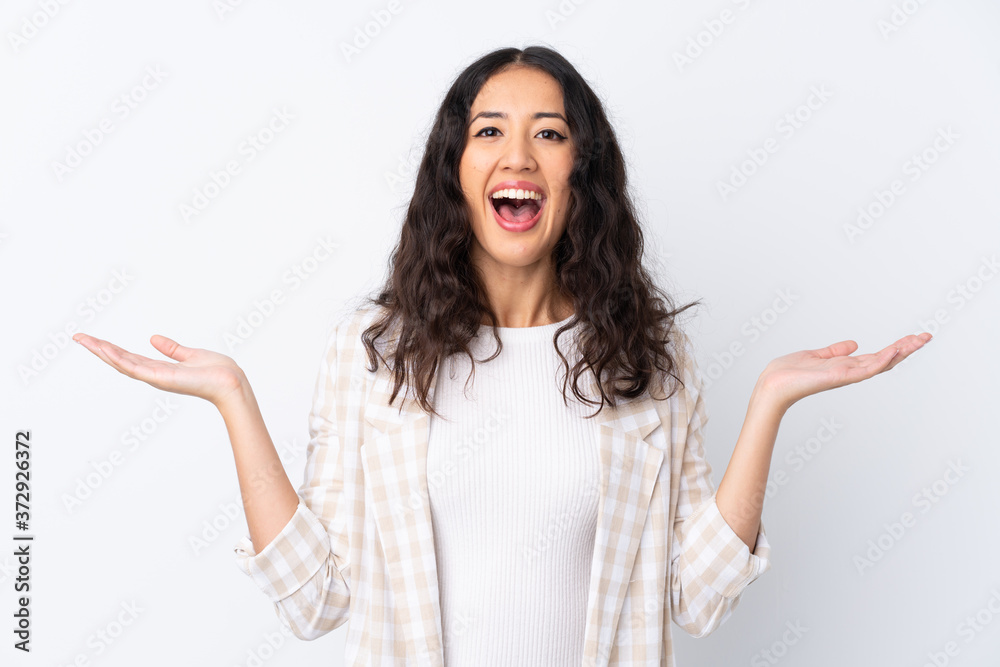 Mixed race woman over isolated white background with shocked facial expression Mixed race woman over isolated white background with shocked facial expression