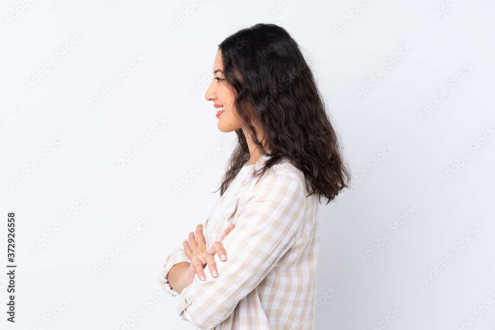 Mixed race woman over isolated white background in lateral position Mixed race woman over isolated white background in lateral position