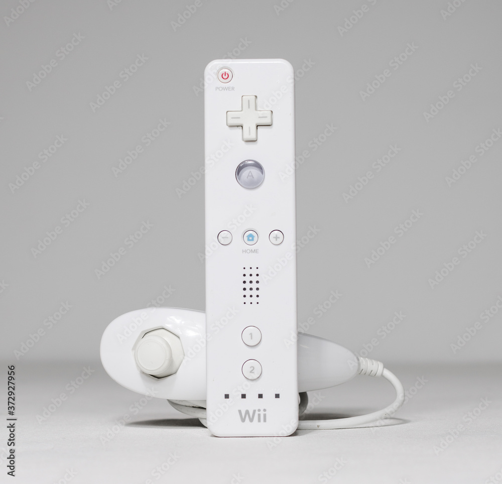 Een goede vriend Bekritiseren Sneeuwstorm london, UK 05/052019 Nintendo wii Controller and nunchuk on a white  isolated background. iconic retro vintage video gaming controller machine.  Stock Photo | Adobe Stock