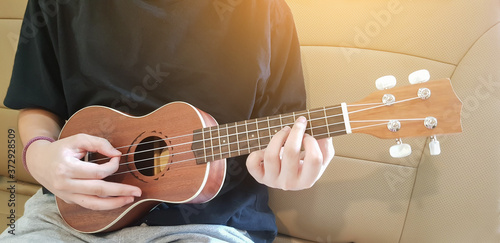 Girl playing ukulele