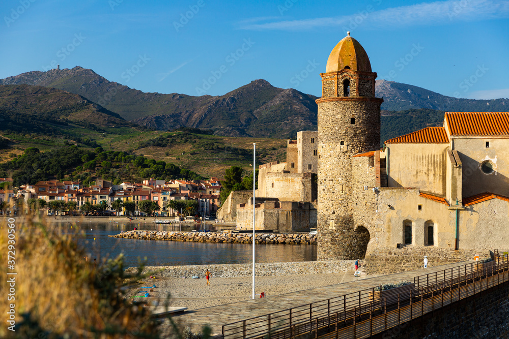 View of sand beach and medieval fort in Collioure, France