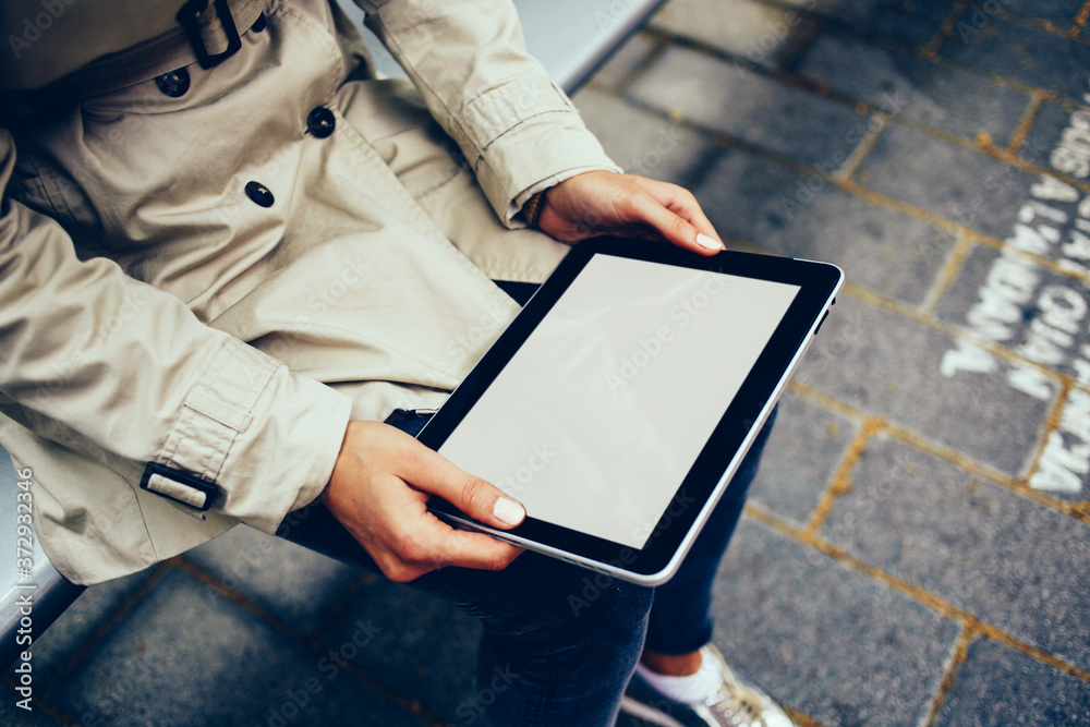 Cropped view of female hands holding digital touch pad device with copy