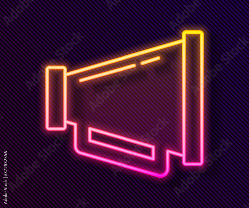 Glowing neon line Megaphone icon isolated on black background. Speaker sign. Vector.