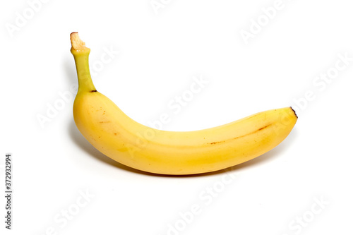 Single banana against white background