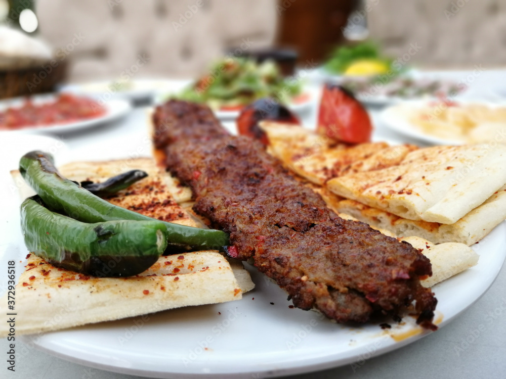 delicious Adana kebab and salads delicious Adana kebab and salads