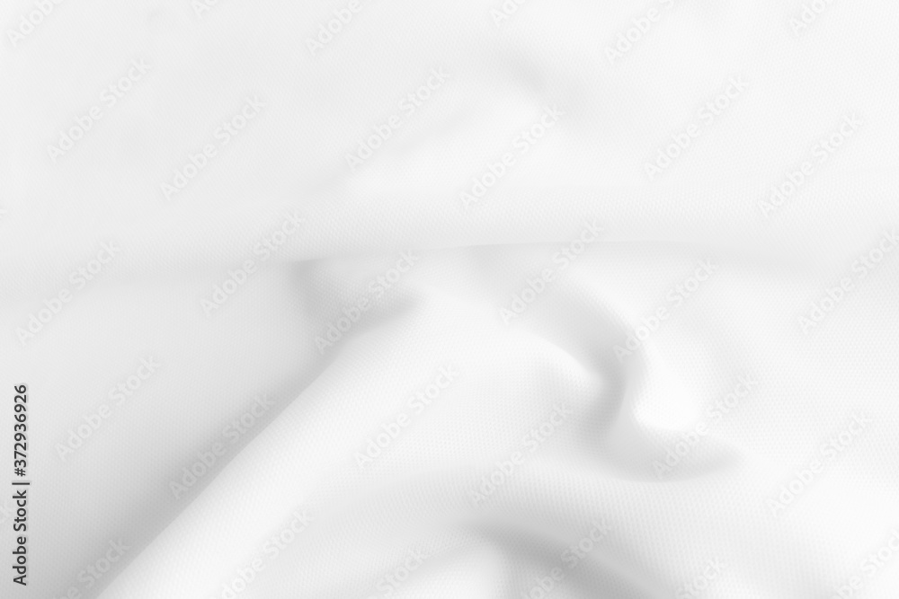 White abstract wavy clothes background. fabric texture