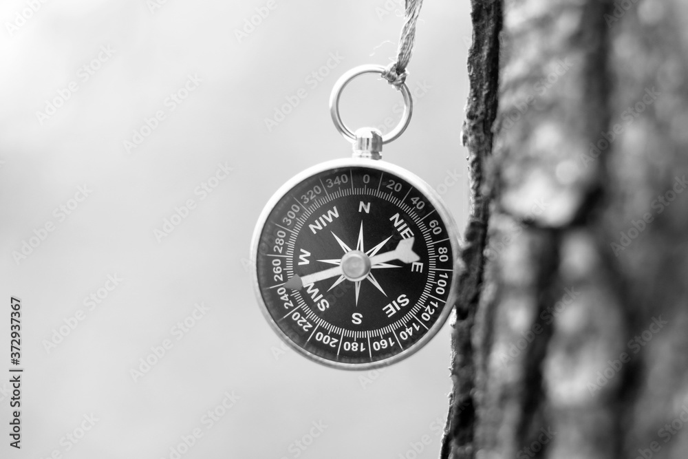 Round Compass Sign black and white photo of round compass in retro style as symbol of ...
