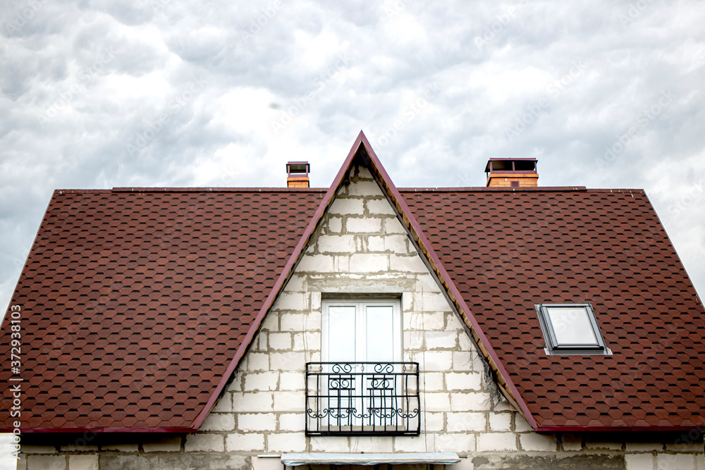 Building a house from white gas-silicate blocks with a soft roof. Unfinished residential building. Construction and repair Building a house from white gas-silicate blocks with a soft roof. Unfinished residential building. Construction and repair