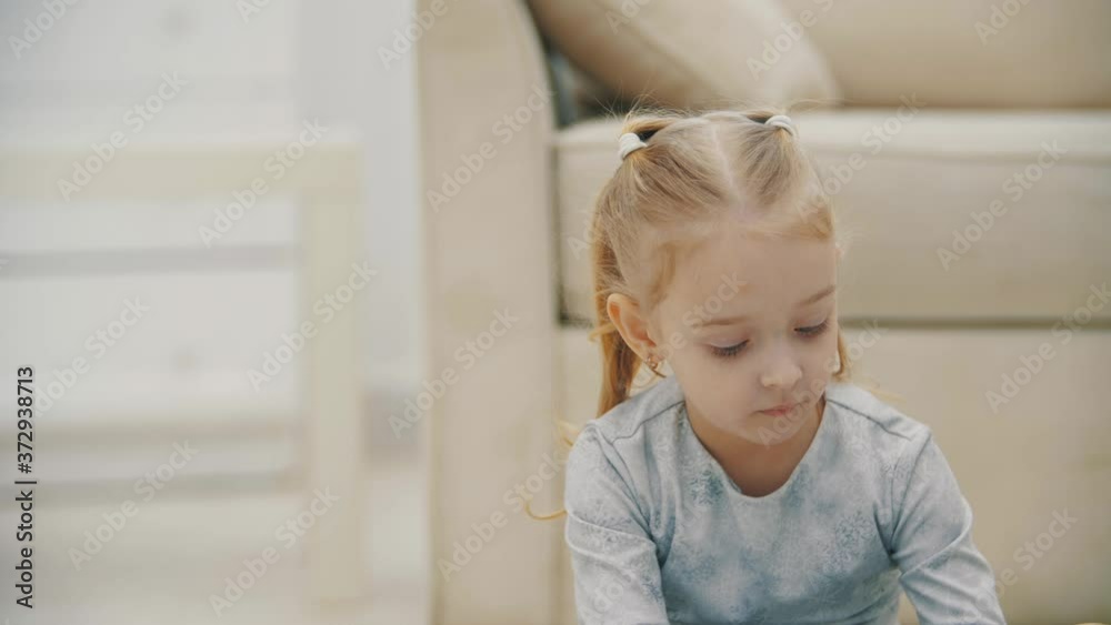 4k slowmotion video of little girl with blue eyes looking at camera. 4k slowmotion video of little girl with blue eyes looking at camera.