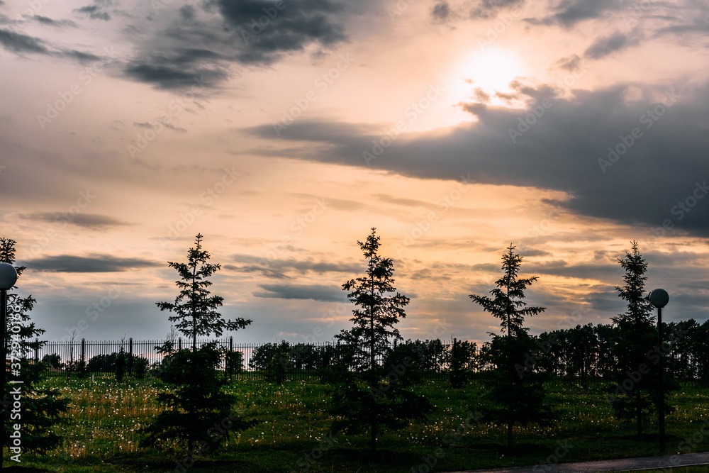 Evening sky with floating white clouds at sunset. The background. Evening sky with floating white clouds at sunset. The background.