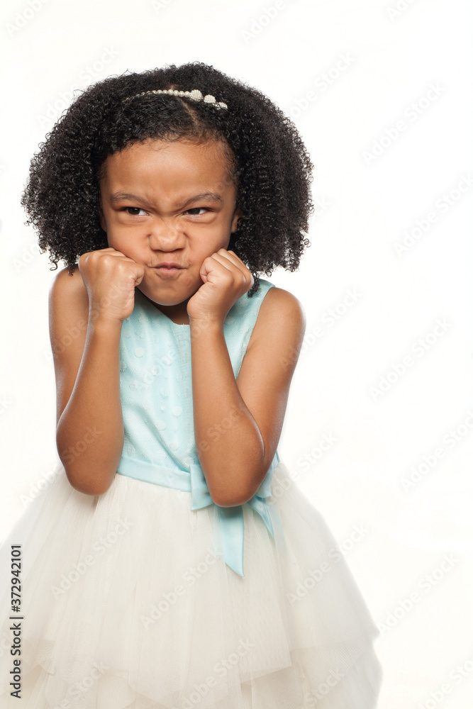 Adorable African American Young Girl with Cute Facial Expression Adorable African American Young Girl with Cute Facial Expression