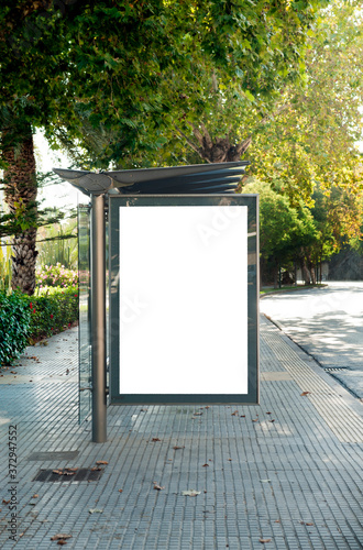 Blank electronic advertising poster with blank space screen for your text message or promotional content, clear banner in urban setting, empty poster at a bus stop, public information billboard