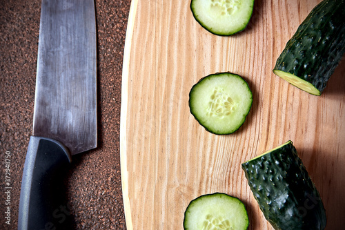 Sliced cucumber on a cutting board photo