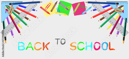 Back to school concept.Vector illustration of school accessories,school supplies on gray background and text.graphic elements for poster or website banner.