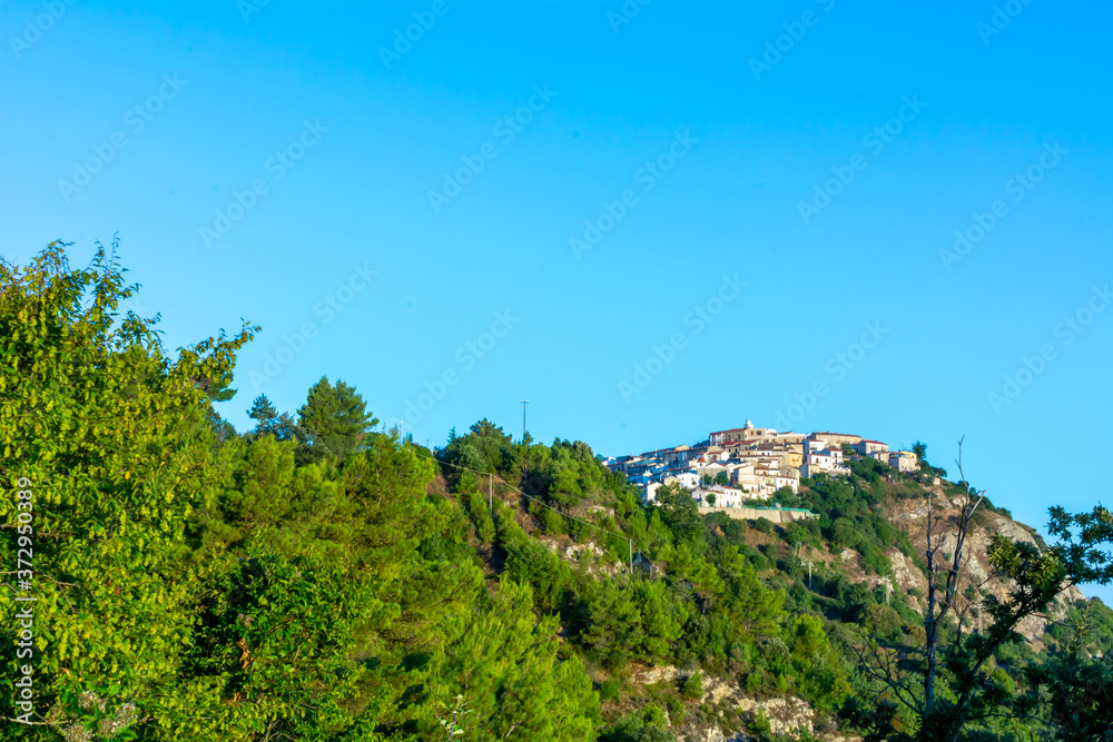Panoramic View of the small village of Castroregio, in Basilicata, Italy. Summer Sunrise of scenic landscape of a small village in the South of Italy Panoramic View of the small village of Castroregio, in Basilicata, Italy. Summer Sunrise of scenic landscape of a small village in the South of Italy