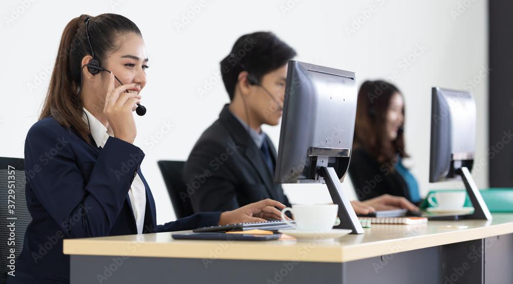 Remote call center team for customer service with a headset.
Remote call center team for customer service with a headset.