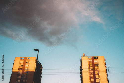 Low angle view of clouds over buildings