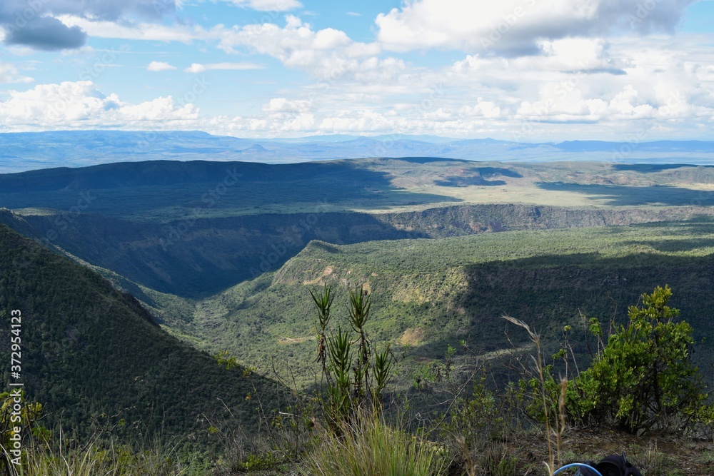 Scenic view of a volcanic crater against mountains at Mount Suswa, Kenya