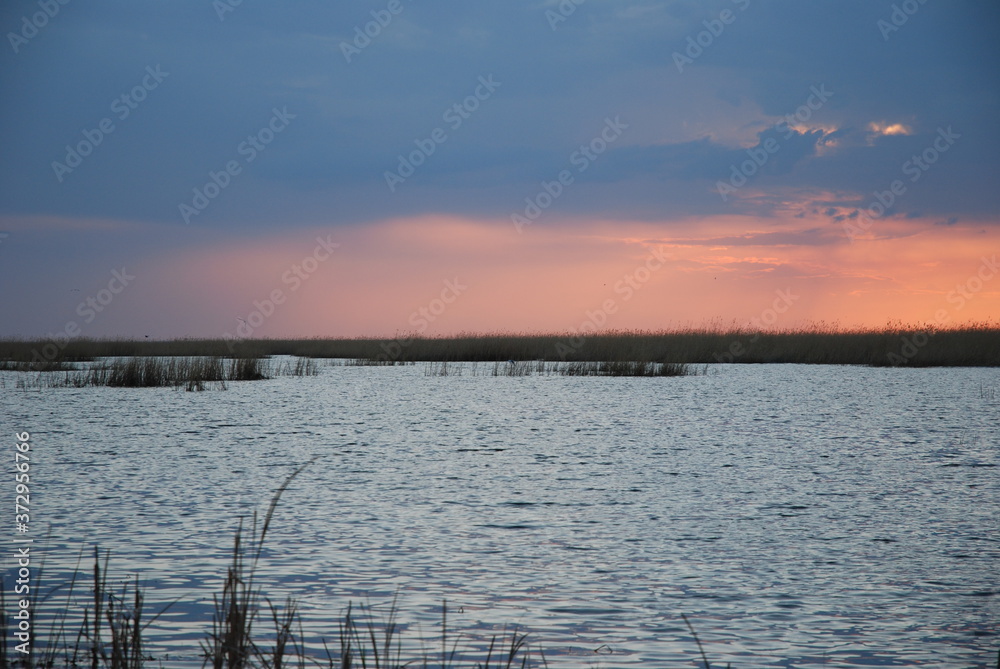 Spring evening on a lake in the steppe. A spring evening descends over the lake.