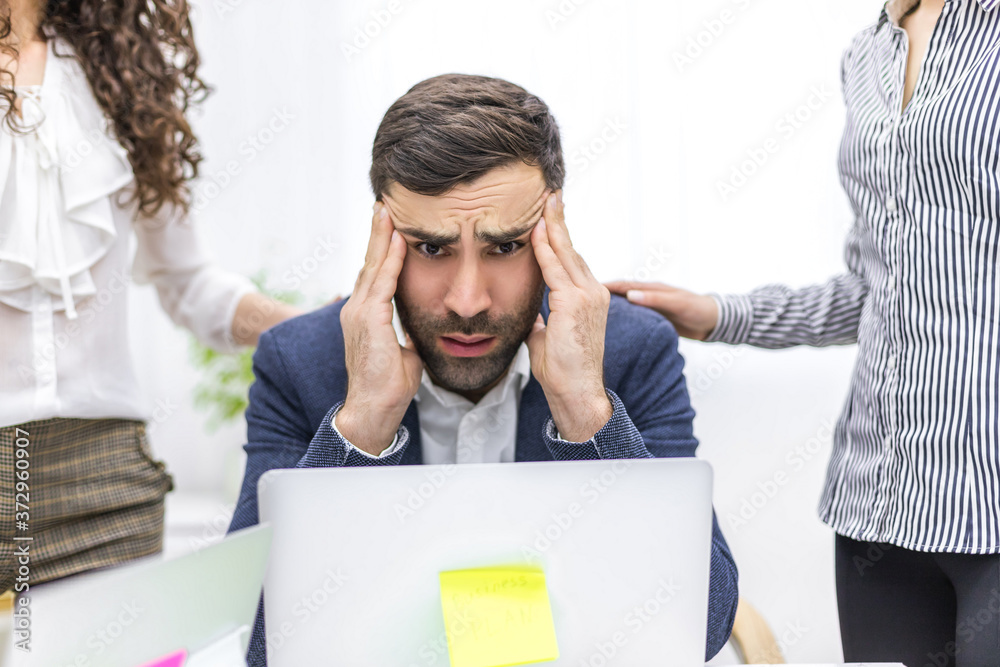 Photo of office manager and co-workers discussing questions. Photo of office manager and co-workers discussing questions.