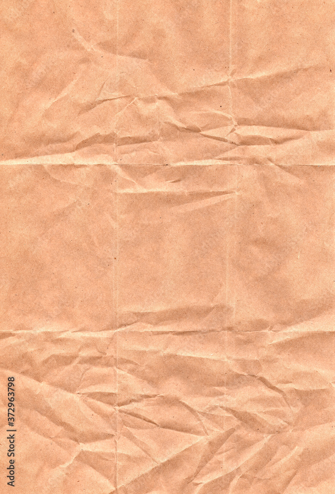 Vertical texture of crumpled brown paper. Substrate for poster. Vertical texture of crumpled brown paper. Substrate for poster.