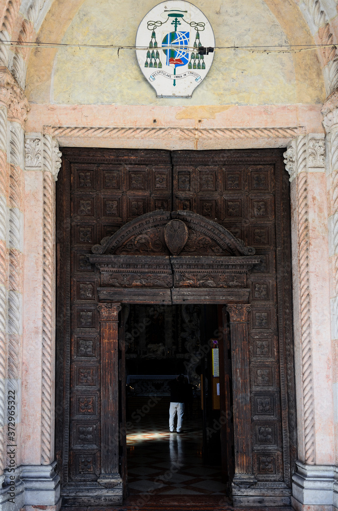 14th century wooden doors of Church of Santa Maria dei Servi (Chiesa di Santa Maria dei Servi) in Padua. Italy