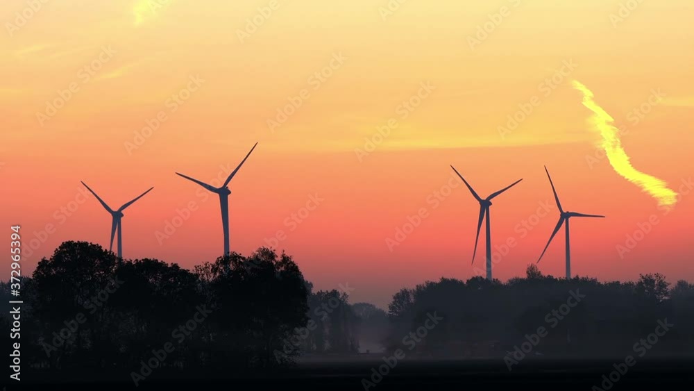 Wind Turbines At Sunrise, timelapse, trees and fog
Wind Turbines At Sunrise, timelapse, trees and fog