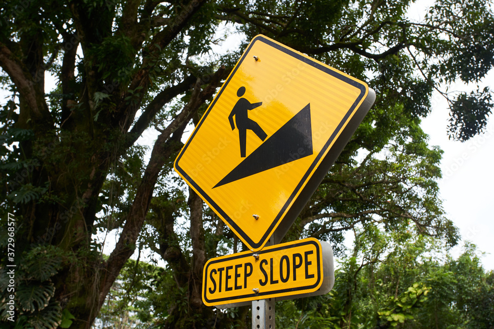 Steep slope sign on a footpath.