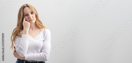 Bilde på lerret young bored woman posing on white background in studio