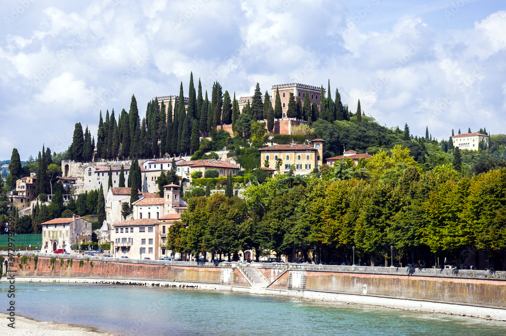 Obraz premium Panoramic view of Castel San Pietro (St. Peter Castle) on hill with cypress trees over the Adige River in Verona, Northern Italy.