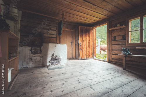 Принти на полотні Abandoned mountain hut or chalet in Austria: rustic wooden interior