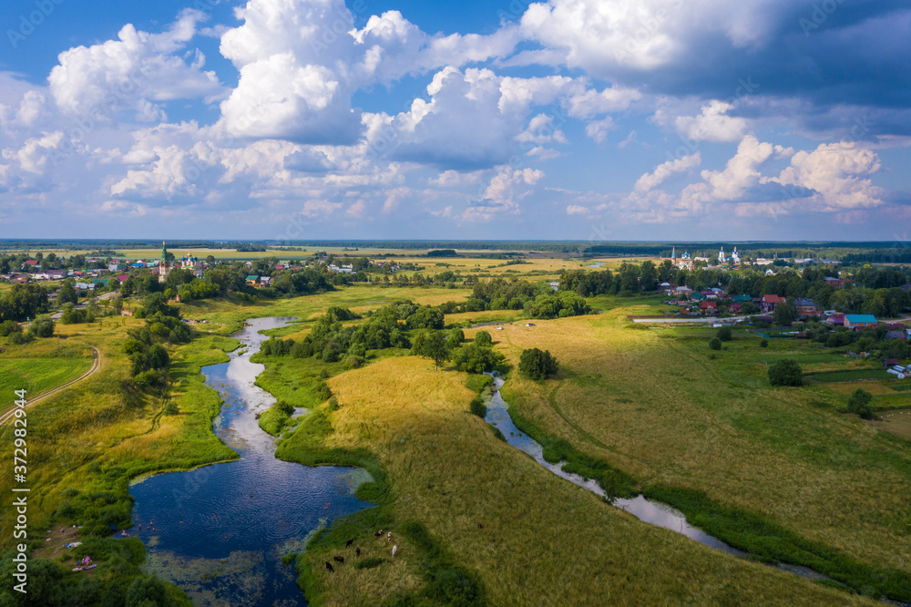 A beautiful view of the villages of Goritsy, Dunilovo and the Teza River, Ivanovo region on a summer day.