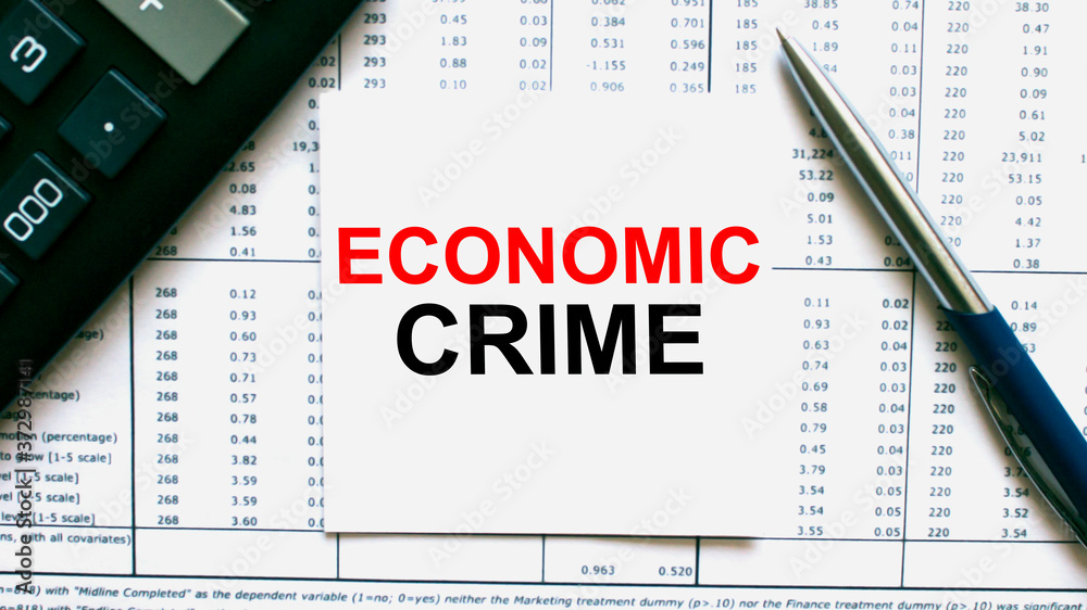 Work smarter text Economic Crime on white sheet with pen, calculator and tables Work smarter text Economic Crime on white sheet with pen, calculator and tables