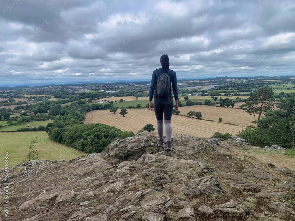 Hiking, walking, single female, with countryside view Hiking, walking, single female, with countryside view