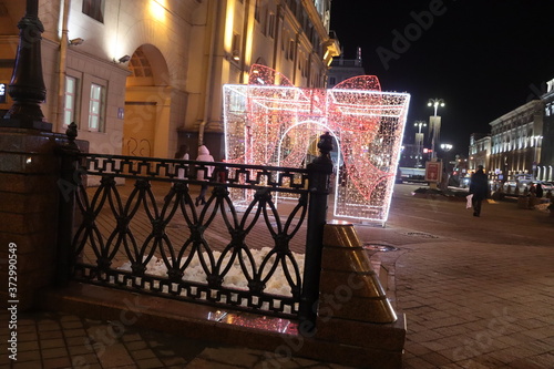 illuminated Christmas archat night street photo