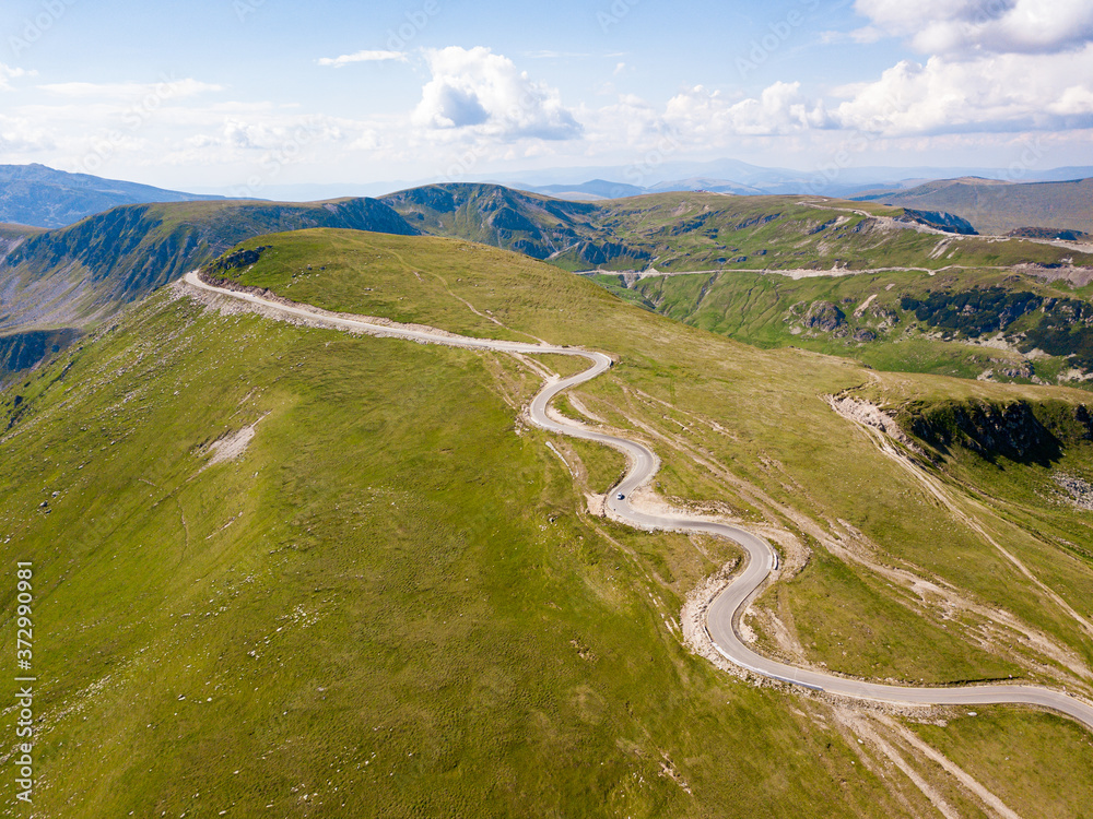 Transalpina pass road in summer. Crossing Carpathian mountains in Romania, Transalpina is one of the most spectacular mountain roads in the world.