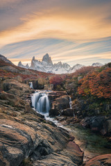 Fotobehang Cappuccinokleur Beautiful mountains and waterfalls, stunning sceneries, popular tourist attractions. The location is in the Glacier National Park, Argentina.  © zhuxiaophotography
