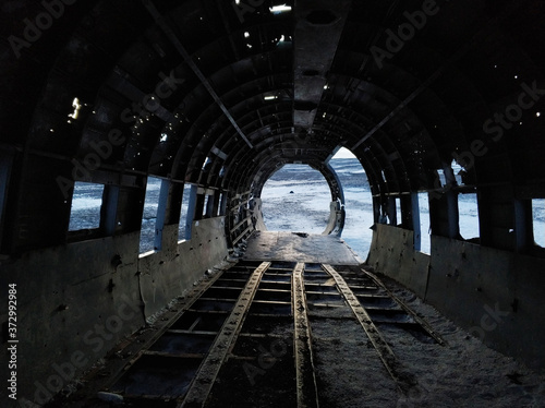 The wreckage of an abandoned DC 3 plane on a black ocean beach in Iceland. Popular attractions in Iceland