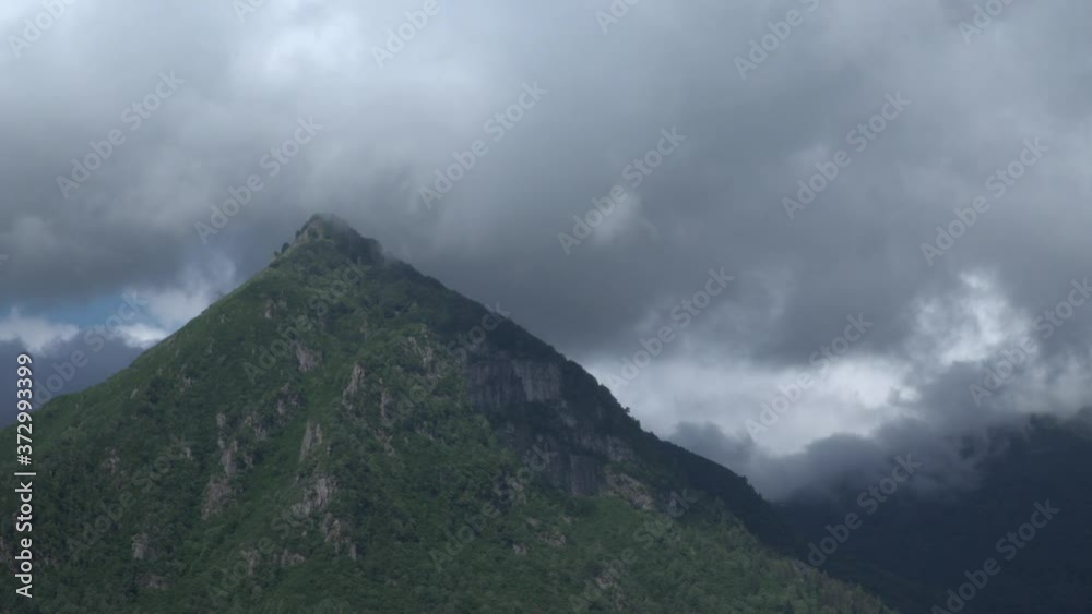 Time lapse of an approaching thunderstorm over a mountain in northern Italy at lake Maggiore Time lapse of an approaching thunderstorm over a mountain in northern Italy at lake Maggiore