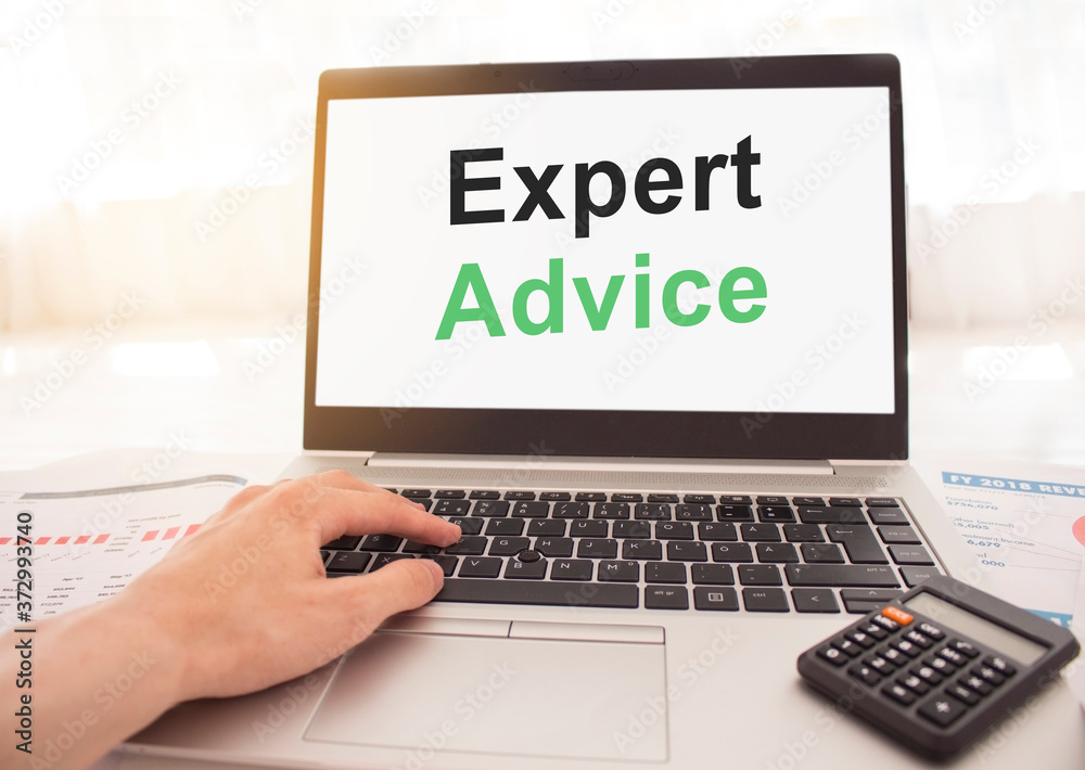 laptop with words Expert advice on white screen, business and finance concept. laptop with words Expert advice on white screen, business and finance concept.
