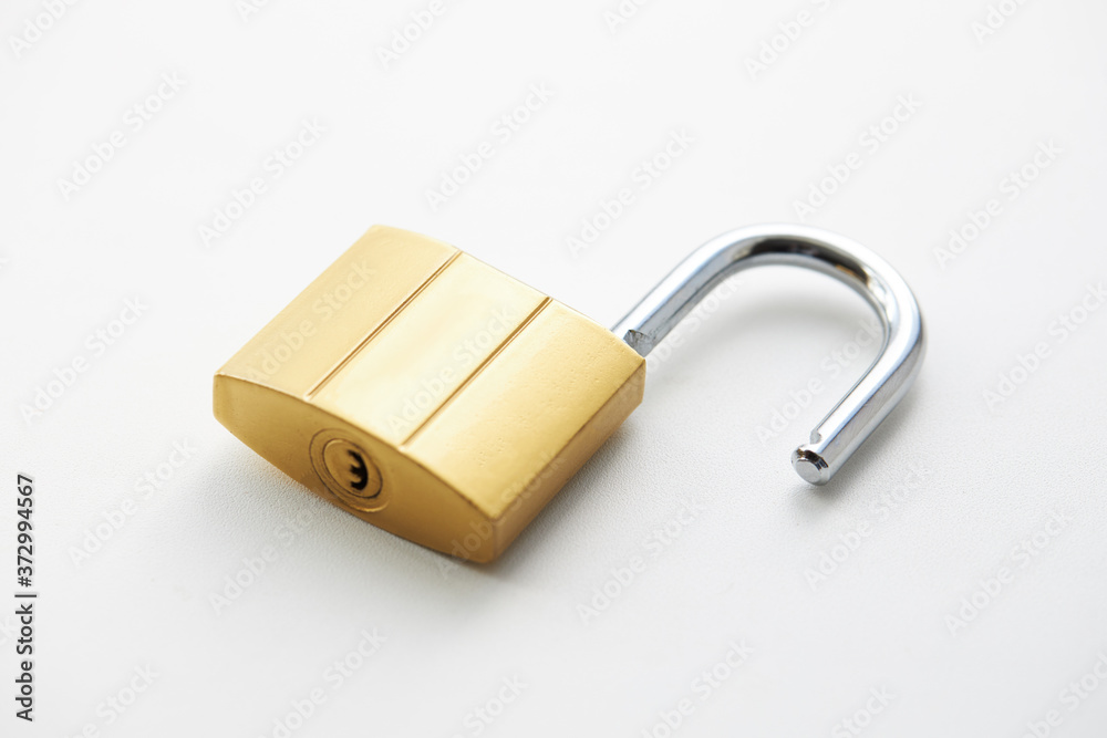 golden colored padlock on a white background. private security and safety concept golden colored padlock on a white background. private security and safety concept