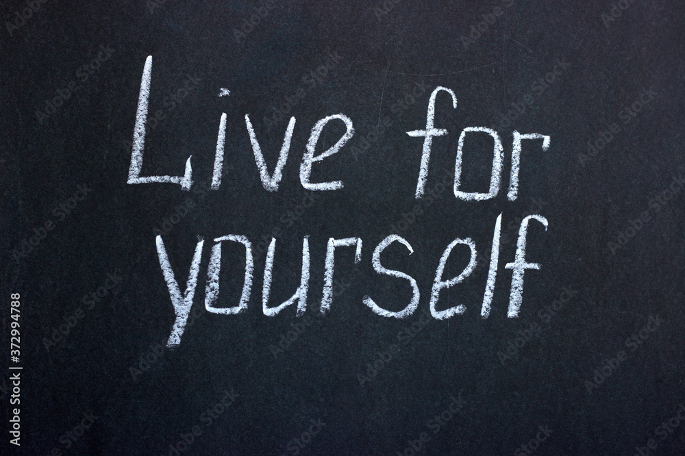 Obraz premium Chalk lettering on a blackboard Live for yourself