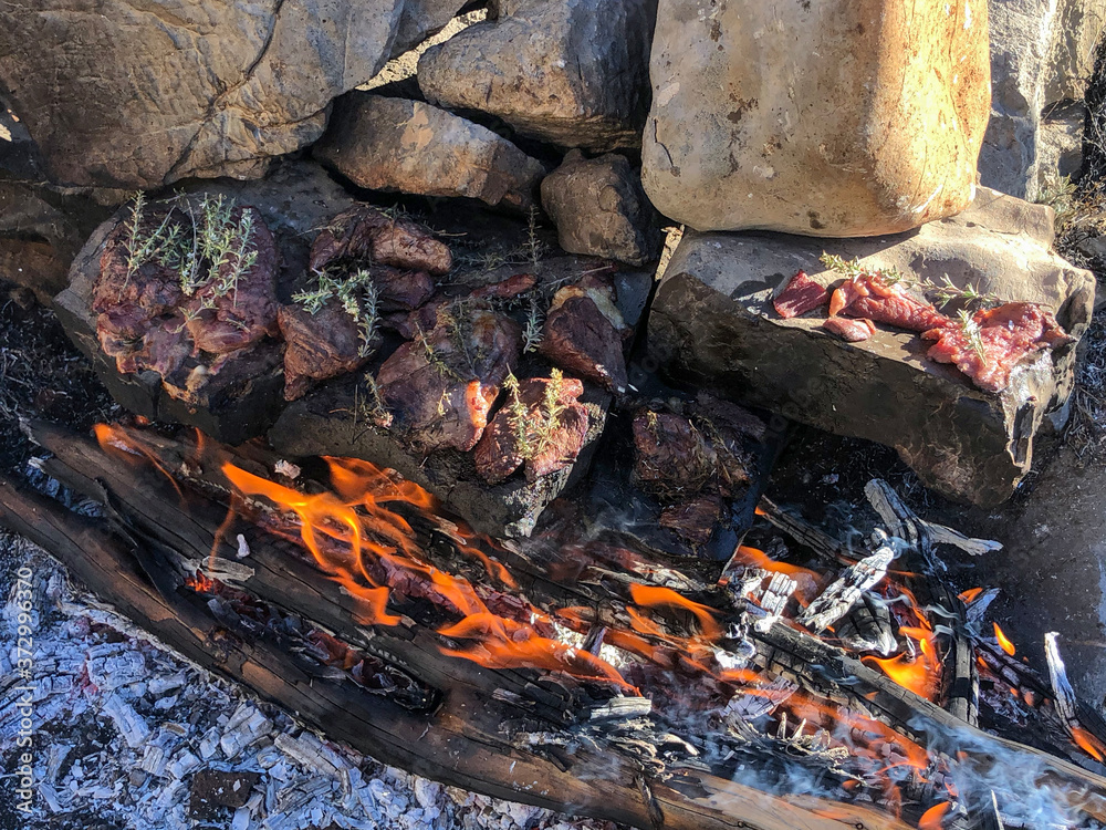 one of the natural methods of cooking meat in camping life one of the natural methods of cooking meat in camping life