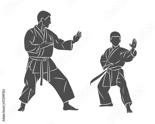 Silhouette Trainer with a young boy in kimono training karate on a white background. Vector illustration