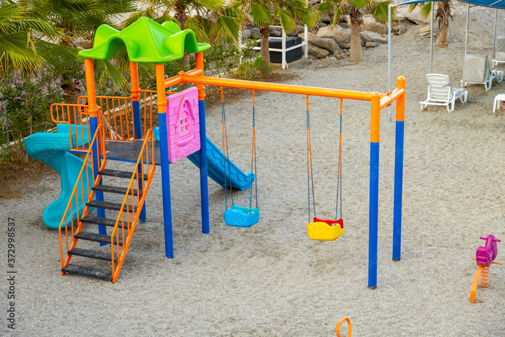 Children playground molded of colorful plastic on the public beach. Children playground molded of colorful plastic on the public beach.