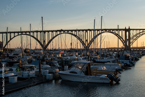 View of Newport Oregon bridge and marina at sunset.
